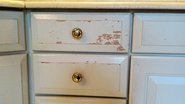 Factory painted cabinet peeling at edges