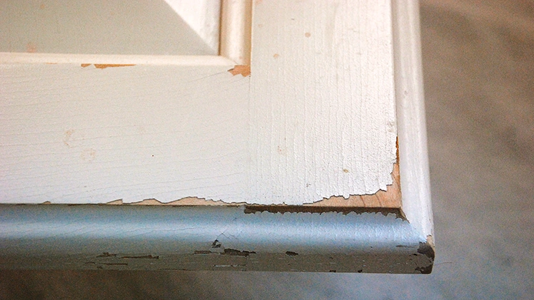 Factory painted cabinet peeling at edges