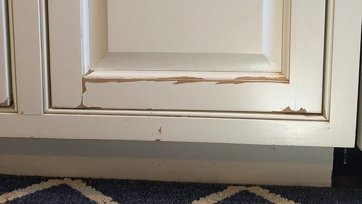 Factory painted cabinet peeling at edges