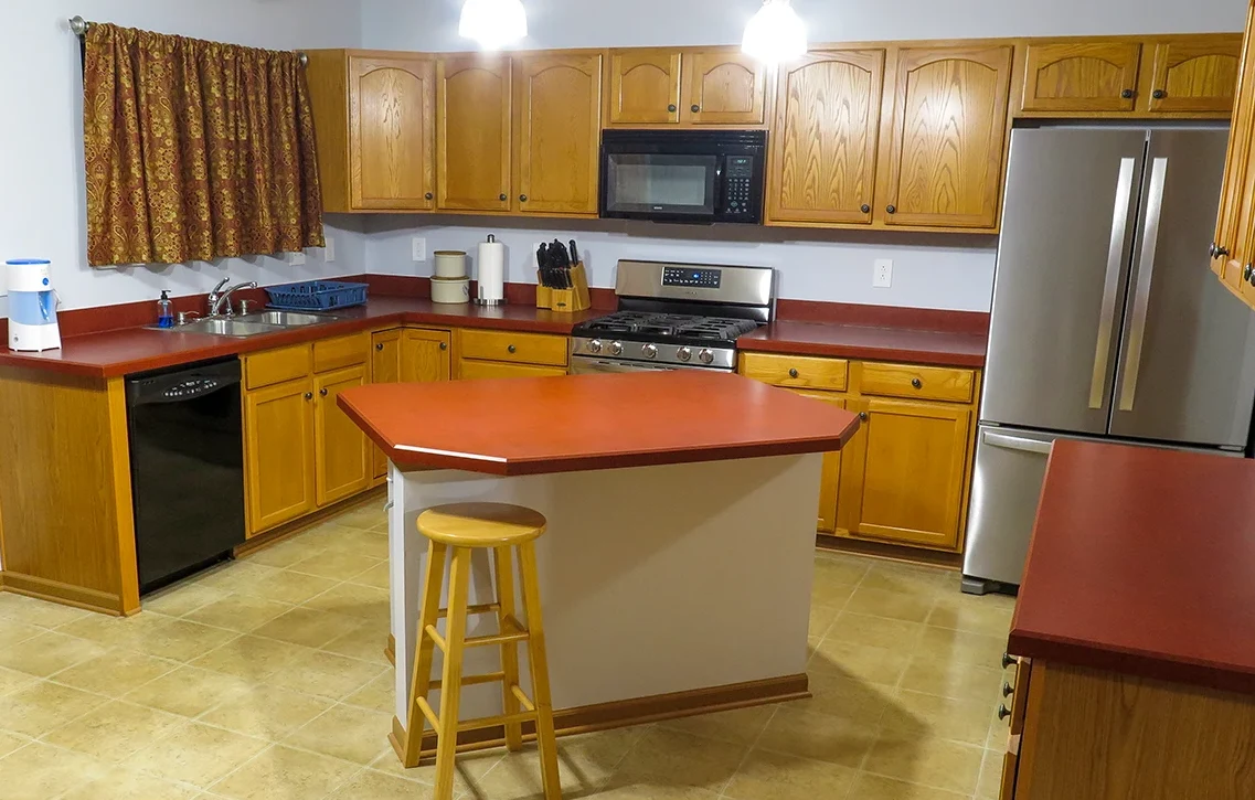 Original oak kitchen cabinets stuck in the 1980s in Lancaster, Ohio