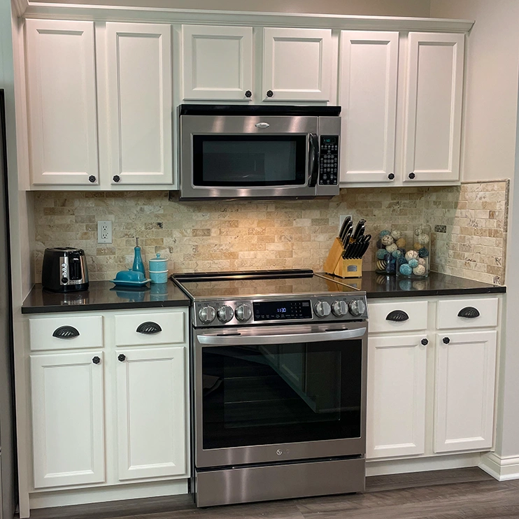 Oak kitchen in Hilliard, OH painted Vintage Blue with black wax