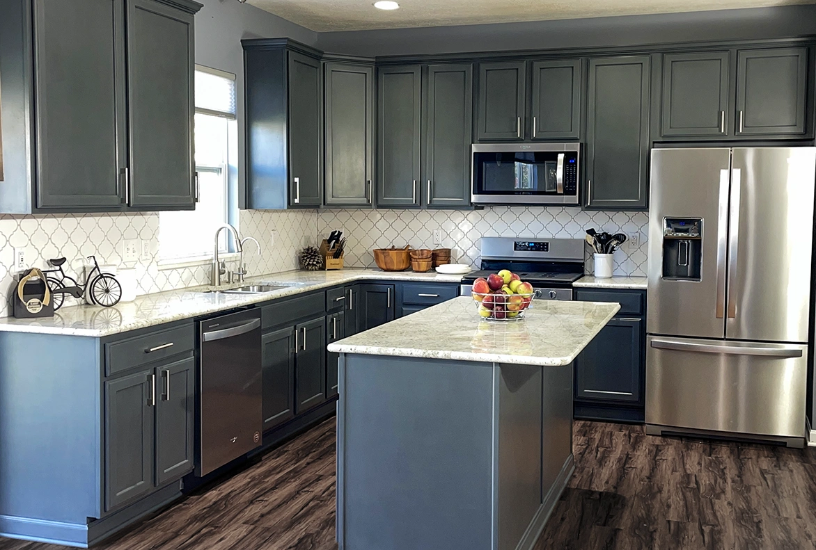 Large maple kitchen in Worthington, Ohio painted blue by Classic Cupboards Paint Studio