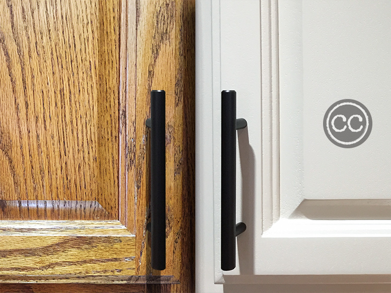 Medium oak cabinet door next to similar door with Classic Cupboards Antique White Paint