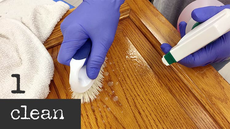 Cleaning a cabinet door in the Classic Cupboards™ Studio